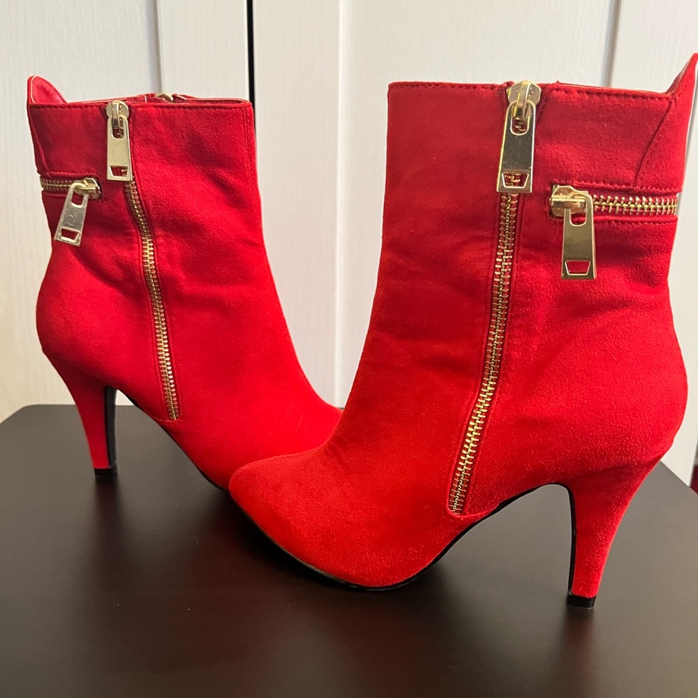 Brand new, maybe worn 1 time around the house. Size 6 red boot heel from DSW